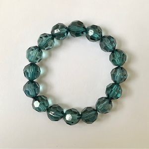 Dark teal blue plastic beads stretch bracelet